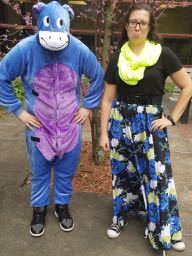 Man in an Eyore costume with woman.